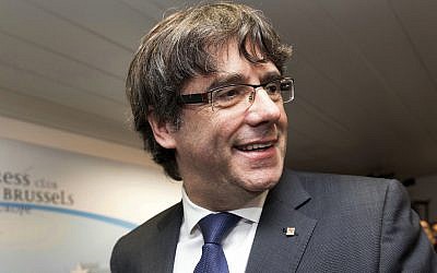 In this Tuesday, Oct. 31, 2017 file photo, ousted Catalan President Carles Puigdemont smiles after a press conference in Brussels. (AP Photo/Olivier Matthys, File)