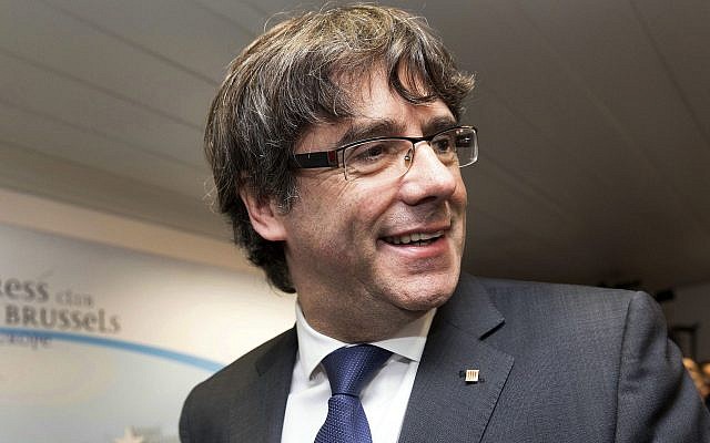 In this Tuesday, Oct. 31, 2017 file photo, ousted Catalan President Carles Puigdemont smiles after a press conference in Brussels. (AP Photo/Olivier Matthys, File) In this Tuesday, Oct. 31, 2017 file photo, ousted Catalan President Carles Puigdemont smiles after a press conference in Brussels. (AP Photo/Olivier Matthys, File)