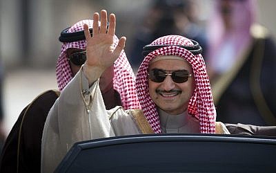 In this file photo from Feb. 4, 2014, Saudi billionaire Prince Alwaleed bin Talal waves as he arrives at the headquarters of Palestinian Authority President Mahmoud Abbas in the West Bank city of Ramallah. (AP Photo/Majdi Mohammed, File)