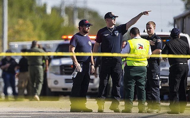 Law enforcement officials work the scene of a fatal shooting at the First Baptist Church in Sutherland Springs, Texas, on November 5, 2017. (Nick Wagner/Austin American-Statesman via AP) Law enforcement officials work the scene of a fatal shooting at the First Baptist Church in Sutherland Springs, Texas, on November 5, 2017. (Nick Wagner/Austin American-Statesman via AP)