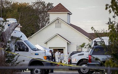 Investigators work at the scene of a deadly shooting at the First Baptist Church in Sutherland Springs, Texas, Sunday Nov. 5, 2017. (Jay Janner/Austin American-Statesman via AP)