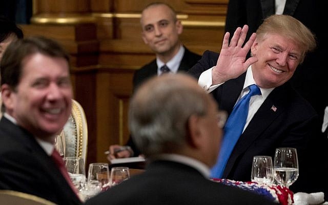 US President Donald Trump, right, accompanied by U.S. Ambassador to Japan William F. Hagerty, left, waves to a guest during a state banquet at the Akasaka Palace, Monday, Nov. 6, 2017, in Tokyo. (AP/Andrew Harnik) US President Donald Trump, right, accompanied by U.S. Ambassador to Japan William F. Hagerty, left, waves to a guest during a state banquet at the Akasaka Palace, Monday, Nov. 6, 2017, in Tokyo. (AP/Andrew Harnik)