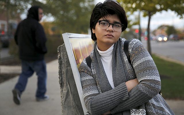 In this Friday, Nov. 3, 2017, photo, Chicago high school senior Hira Zeeshan poses for a portrait in the West Ridge neighborhood of Chicago. (AP Photo/Charles Rex Arbogast) In this Friday, Nov. 3, 2017, photo, Chicago high school senior Hira Zeeshan poses for a portrait in the West Ridge neighborhood of Chicago. (AP Photo/Charles Rex Arbogast)