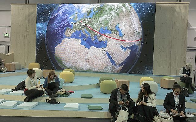 Participants at the World Climate Conference working in front of the depiction of a globe in Bonn, Germany, Tuesday, November 7, 2017. (Oliver Berg/dpa via AP) Participants at the World Climate Conference working in front of the depiction of a globe in Bonn, Germany, Tuesday, November 7, 2017. (Oliver Berg/dpa via AP)