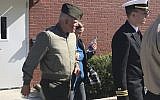In this October 31, 2017 file photo, US Marine Gunnery Sgt. Joseph A. Felix, his wife, and his lawyers exit a courtroom after testimony at Camp Lejeune, North Carolina. (Rory Laverty/The Washington Post via AP)