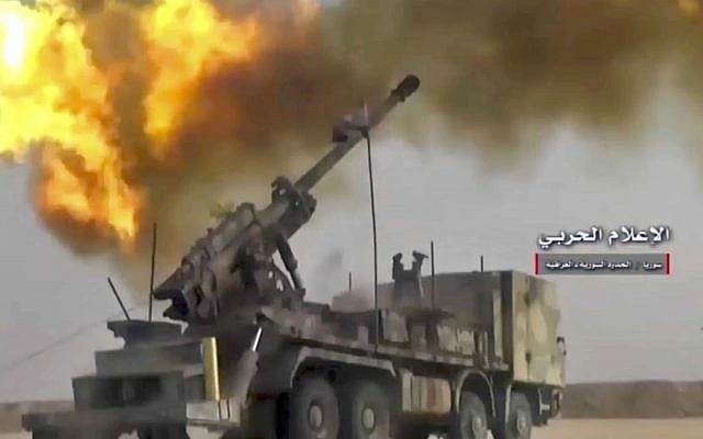 A frame grab from video provided by the government-controlled Syrian Central Military Media, shows firing on militants' positions on the Iraq-Syria border, November 8, 2017. (Syrian Central Military Media, via AP) A frame grab from video provided by the government-controlled Syrian Central Military Media, shows firing on militants' positions on the Iraq-Syria border, November 8, 2017. (Syrian Central Military Media, via AP)