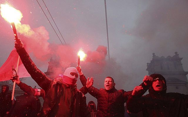 Nationalists burn flares as they march in large numbers through the streets of Warsaw to mark Poland's Independence Day, November 11, 2016, (AP Photo/Czarek Sokolowski, File) Nationalists burn flares as they march in large numbers through the streets of Warsaw to mark Poland's Independence Day, November 11, 2016, (AP Photo/Czarek Sokolowski, File)