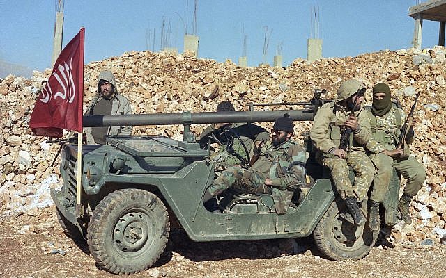 In this December 5, 1989 photo, masked gunmen of the pro-Iranian Shiite Muslim Hezbollah terror group, clad in military uniforms, are seen in the village of Sohmor, Lebanon. (AP Photo) In this December 5, 1989 photo, masked gunmen of the pro-Iranian Shiite Muslim Hezbollah terror group, clad in military uniforms, are seen in the village of Sohmor, Lebanon. (AP Photo)