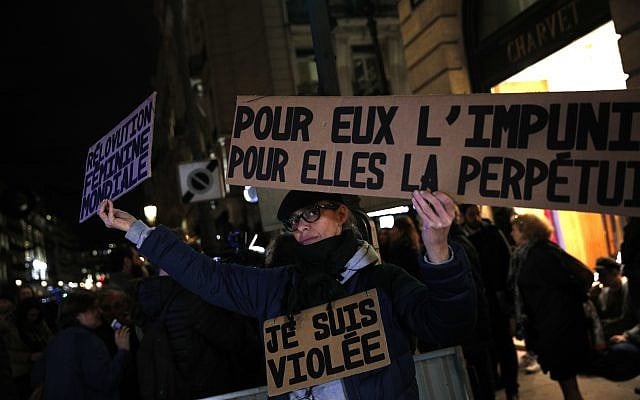 Activist holding a banner reading: "For him impunity, for her a life sentence" during a protest in Paris, November 14, 2017. (AP Photo/Christophe Ena, File) Activist holding a banner reading: "For him impunity, for her a life sentence" during a protest in Paris, November 14, 2017. (AP Photo/Christophe Ena, File)