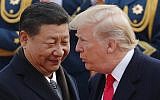 US President Donald Trump, right, chats with Chinese President Xi Jinping during a welcome ceremony at the Great Hall of the People in Beijing, November 9, 2017. (AP/Andy Wong)