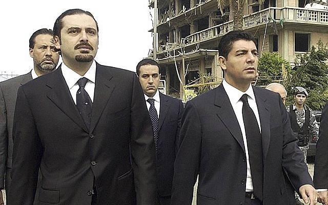 In this Feb. 19, 2005 file photo, Bahaa Hariri, right, and Saad Hariri, sons of slain Lebanese former Prime Minister Rafik Hariri, visit the scene where their father was assassinated in Beirut, Lebanon (AP photo, File)