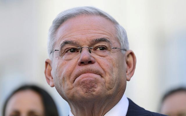 Democratic Sen. Bob Menendez becomes emotional as he speaks to reporters in front of the courthouse in Newark, N.J., November 16, 2017. (AP Photo/Seth Wenig)