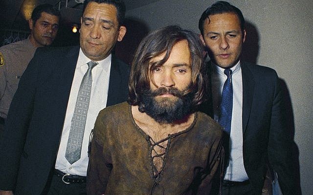 In this 1969 file photo, Charles Manson is escorted to his arraignment on conspiracy-murder charges in connection with the Sharon Tate murder case. (AP Photo, File) In this 1969 file photo, Charles Manson is escorted to his arraignment on conspiracy-murder charges in connection with the Sharon Tate murder case. (AP Photo, File)