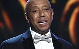 In this Feb. 6, 2015, file photo, hip-hop mogul Russell Simmons presents the Vanguard Award on stage at the 46th NAACP Image Awards in Pasadena, California (Chris Pizzello/Invision/AP, File)