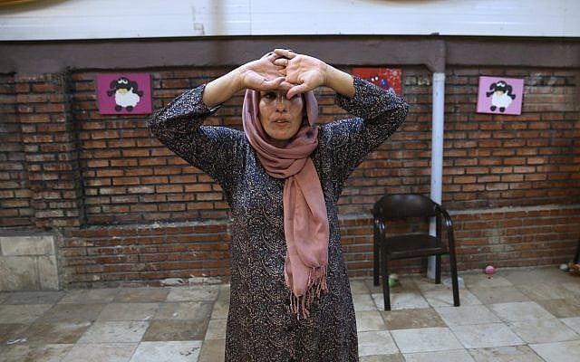 In this Wednesday, Sept. 27, 2017 photo, Mahboobeh Zeinali, who is HIV-positive, attends an acting class at Reviving Values aid group institute in Tehran, Iran. (AP Photo/Vahid Salemi) In this Wednesday, Sept. 27, 2017 photo, Mahboobeh Zeinali, who is HIV-positive, attends an acting class at Reviving Values aid group institute in Tehran, Iran. (AP Photo/Vahid Salemi)
