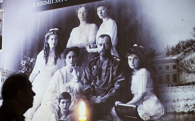 In this file photo taken on Nov. 12, 2015, a visitor walks past a photo showing Russia's last Czar Nicholas II with his family at the 1914-1945 Russia history exhibition in Moscow, Russia. (AP Photo/Alexander Zemlianichenko, File) In this file photo taken on Nov. 12, 2015, a visitor walks past a photo showing Russia's last Czar Nicholas II with his family at the 1914-1945 Russia history exhibition in Moscow, Russia. (AP Photo/Alexander Zemlianichenko, File)