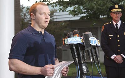 New York City Police Officer Ryan Nash speaks to reporters at the Suffolk County Police Department's Fifth Precinct on Wednesday, Nov. 1, 2017, in Patchogue, N.Y. Nash shot the driver of a rental truck that ran down pedestrians and bicyclists in a suspected terrorism attack in New York City on Tuesday, Oct. 31, 2017. Nash read from a brief prepared statement but declined to answer any questions because of an ongoing investigation into the incident. (AP Photo/Frank Eltman)