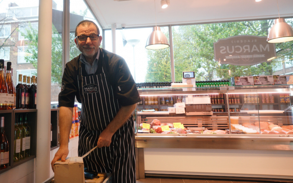 Nissim Guedj unpacking merchandise at a kosher meat shop in Amsterdam, October 26, 2017. (Cnaan Liphshiz/JTA) Nissim Guedj unpacking merchandise at a kosher meat shop in Amsterdam, October 26, 2017. (Cnaan Liphshiz/JTA)