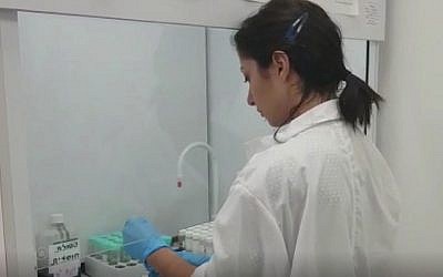 Screen capture from video showing a technician testing for banned substances in a laboratory at the Kerem Shalom border crossing with the Gaza Strip. (Defense Ministry)