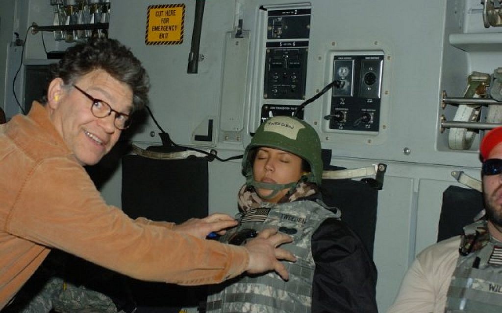 A photograph released by Leeann Tweeden on November 16, 2017, which shows her sleeping on board an aircraft, with Al Franken shown reaching out as if to grope her breasts (Twitter) A photograph released by Leeann Tweeden on November 16, 2017, which shows her sleeping on board an aircraft, with Al Franken shown reaching out as if to grope her breasts (Twitter)