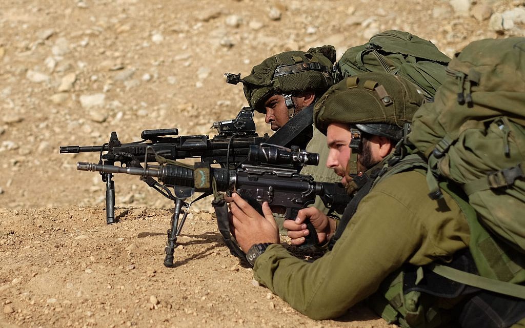 Soldiers from the IDF's Kfir Brigade open fire on targets during a training exercise in the Jordan Valley on November 28, 2017. (Judah Ari Gross/Times of Israel)