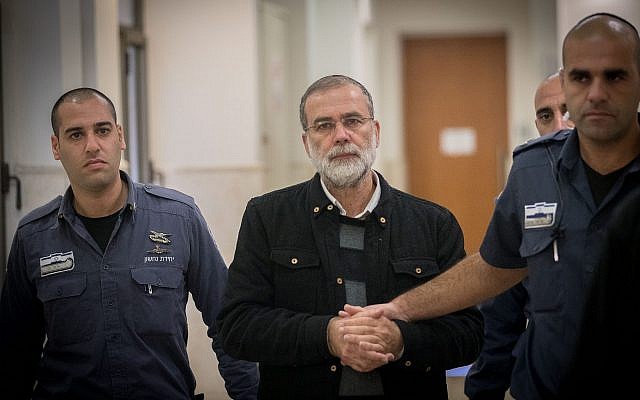 Rabbi David Harison is brought for a hearing at the Jerusalem District Court on December 18, 2016. (Yonatan Sindel/Flash90) Rabbi David Harison is brought for a hearing at the Jerusalem District Court on December 18, 2016. (Yonatan Sindel/Flash90)