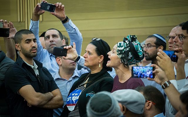 Adva Biton, mother of Adele Biton, who was injured at a terror attack and died later from her wounds, reacts during a Likud party faction meeting at the Knesset on November 6, 2017. (Miriam Alster/Flash90) Adva Biton, mother of Adele Biton, who was injured at a terror attack and died later from her wounds, reacts during a Likud party faction meeting at the Knesset on November 6, 2017. (Miriam Alster/Flash90)