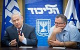 Prime Minister Benjamin Netanyahu (left) with coalition chairman David Bitan at a Likud faction meeting at the Knesset on November 27, 2017. (Miriam Alster/Flash90)