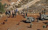 Illustrative: Palestinians clash with Israeli security forces following riots between Palestinians and a group of settlers traveling in the northern West Bank, on November 30, 2017. (Nasser Ishtayeh/Flash90)