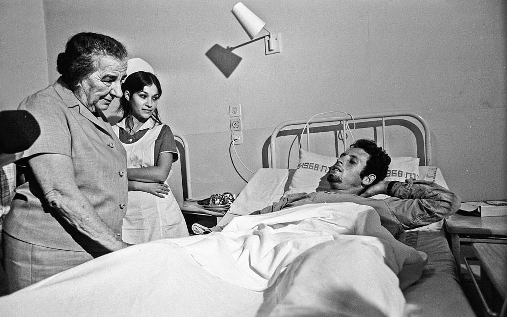 Then-prime minister Golda Meir visiting a wounded soldier in hospital during the 1973 Yom Kippur War. (Herman Chanania/GPO) Then-prime minister Golda Meir visiting a wounded soldier in hospital during the 1973 Yom Kippur War. (Herman Chanania/GPO)