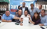Settler leaders agree to a deal with the government to end their protest outside the Prime Minister's Residence in Jerusalem on November 10, 2017. From left to right: David Bitan, Beit Aryeh Mayor Avi Naim, MK Oren Hazan, Shomron Regional Council head Yossi Dagan, Itzhak Abutbul, Hadas Mizrahi, Kiryat Arba-Hebron Mayor Melachi Levinger. (Courtesy: Samaria Regional Council)