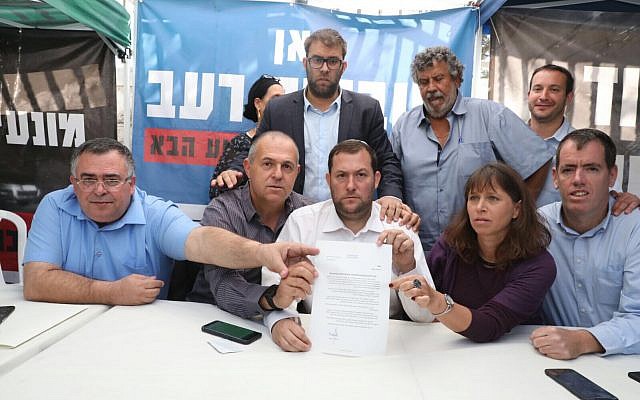 Settler leaders agree to a deal with the government to end their protest outside the Prime Minister's Residence in Jerusalem on November 10, 2017. From left to right: David Bitan, Beit Aryeh Mayor Avi Naim, MK Oren Hazan, Shomron Regional Council head Yossi Dagan, Itzhak Abutbul, Hadas Mizrahi, Kiryat Arba-Hebron Mayor Melachi Levinger. (Courtesy: Samaria Regional Council) Settler leaders agree to a deal with the government to end their protest outside the Prime Minister's Residence in Jerusalem on November 10, 2017. From left to right: David Bitan, Beit Aryeh Mayor Avi Naim, MK Oren Hazan, Shomron Regional Council head Yossi Dagan, Itzhak Abutbul, Hadas Mizrahi, Kiryat Arba-Hebron Mayor Melachi Levinger. (Courtesy: Samaria Regional Council)