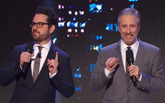 Star Wars filmmaker J.J. Abrams (left) offers to leak the plot of the ninth episode to the highest donor for HBO's autism benefit, 'Night of Too Many Stars,' hosted by Jon Stewart on November 18, 2017. (YouTube screenshot) Star Wars filmmaker J.J. Abrams (left) offers to leak the plot of the ninth episode to the highest donor for HBO's autism benefit, 'Night of Too Many Stars,' hosted by Jon Stewart on November 18, 2017. (YouTube screenshot)