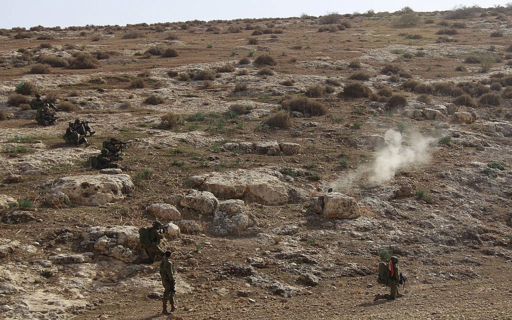 Soldiers from the IDF's Kfir Brigade open fire on targets during a training exercise in the Jordan Valley on November 28, 2017. (Judah Ari Gross/Times of Israel)