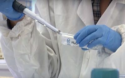 A worker in the Unimore CMR laboratory making artificial skin. (Screen capture: YouTube)
