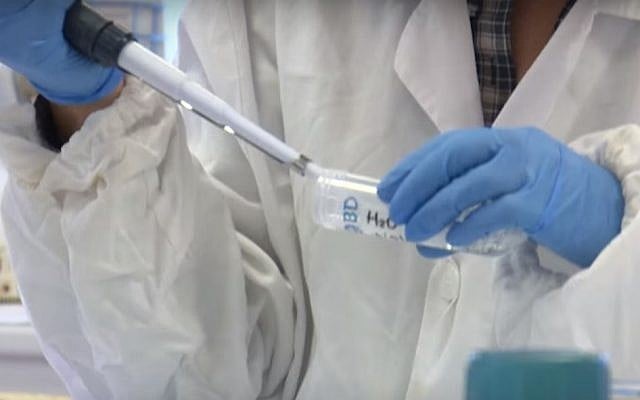 A worker in the Unimore CMR laboratory making artificial skin. (Screen capture: YouTube) A worker in the Unimore CMR laboratory making artificial skin. (Screen capture: YouTube)