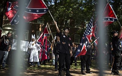 Ku Klux Klan members on July 8, 2017 in Charlottesville, Virginia protesting the planned removal of a statue of General Robert E. Lee, and calling for the protection of Southern Confederate monuments. (Chet Strange/Getty Images via JTA)