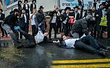 Ultra-Orthodox Jewish men clash with police during a protest against the army draft at a main road in Bnei Brak on November 20, 2017.  Yossi Zeliger/Flash90