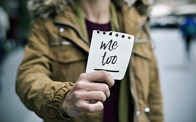 Illustrative image of a victim of sexual harassment holding a note with the text 'me too.' (nito100/iStock by Getty Images)