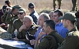 Defense Minister Avigdor Liberman, center, meets with Brig. Gen. Yaniv Assur, who commands the division responsible for the Golan Heights, right, and IDF Chief of Staff Gadi Eisenkot, left, during a tour of northern Israel on November 15, 2017. (Ariel Hermoni/Defense Ministry)