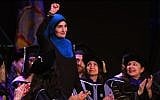 Linda Sarsour speaking at the CUNY Graduate School of Public Health’s inaugural commencement ceremony at the Apollo Theatre in New York City, June 1, 2017. (Timothy A. Clary/AFP/Getty Images via JTA)