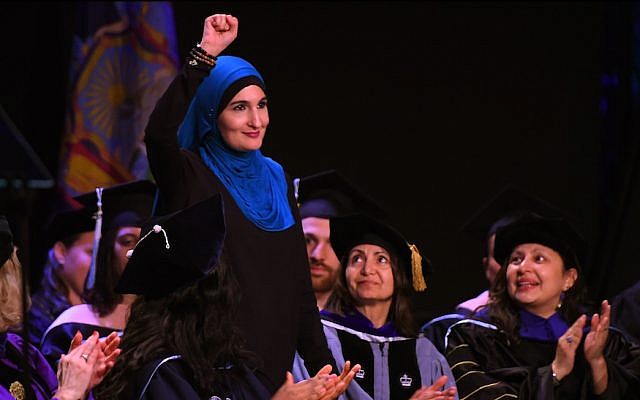 Linda Sarsour speaking at the CUNY Graduate School of Public Health’s inaugural commencement ceremony at the Apollo Theatre in New York City, June 1, 2017. (Timothy A. Clary/AFP/Getty Images via JTA) Linda Sarsour speaking at the CUNY Graduate School of Public Health’s inaugural commencement ceremony at the Apollo Theatre in New York City, June 1, 2017. (Timothy A. Clary/AFP/Getty Images via JTA)