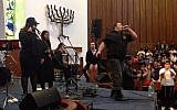 Yair Pomburg raps during a performance of the Shalva Band at North Shore Hebrew Academy on Long Island. (Ben Sales via JTA)