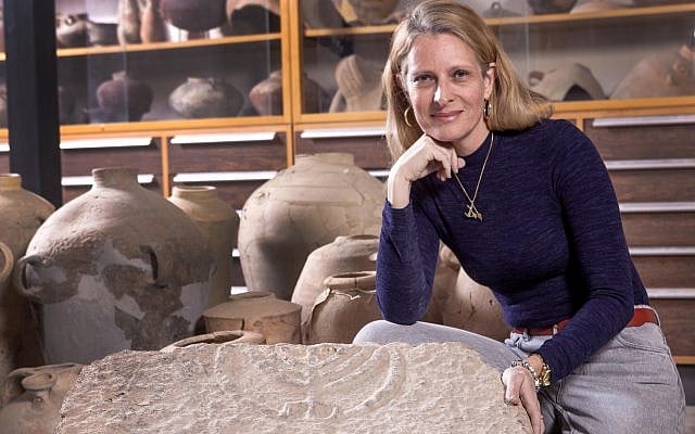 Hebrew University's Dr. Katya Tzitrin Silverman with the circa 1,800-year-old menorah found in Tiberius. (Tal Rogoveski)