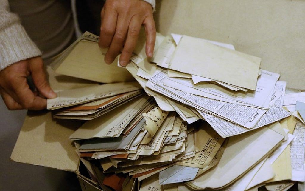 Judaica Research Centre chief Lara Lempertiene files through rediscovered Jewish documents, long thought to have been destroyed during World War II, in Lithuanian national library in Vilnius on November 3, 2017. (AFP PHOTO / Petras Malukas)