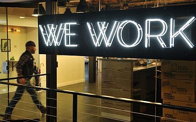 A man enters the WeWork cooperative co-working space in Washington, DC, on March 13, 2014. (AFP/Mandel Ngan)