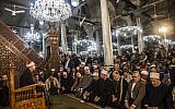 Egyptians listen to a Muslim cleric at the Al-Hussein mosque in Cairo during celebrations of the birthday of Islam's Prophet Mohammed, known in Arabic as "al-Mawlid al-Nabawi", on December 1, 2017. (AFP PHOTO / KHALED DESOUKI)