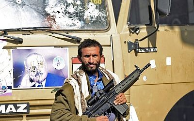 A Huthi rebel fighter is seen outside of the residence of Yemen's former President Ali Abdullah Saleh in Sanaa on December 4, 2017.
(AFP/MOHAMMED HUWAIS)