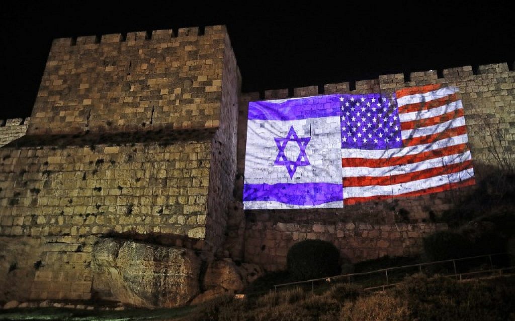 A giant US flag screened alongside Israel's national flag on the walls of the Old City in Jerusalem, December 6, 2017. (Ahmad Gharabli/AFP)