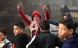 Palestinian youths take part in a protest against US President Donald Trump's decision to recognize Jerusalem as the capital of Israel, in Gaza City, December 7, 2017. (MOHAMMED ABED/AFP)